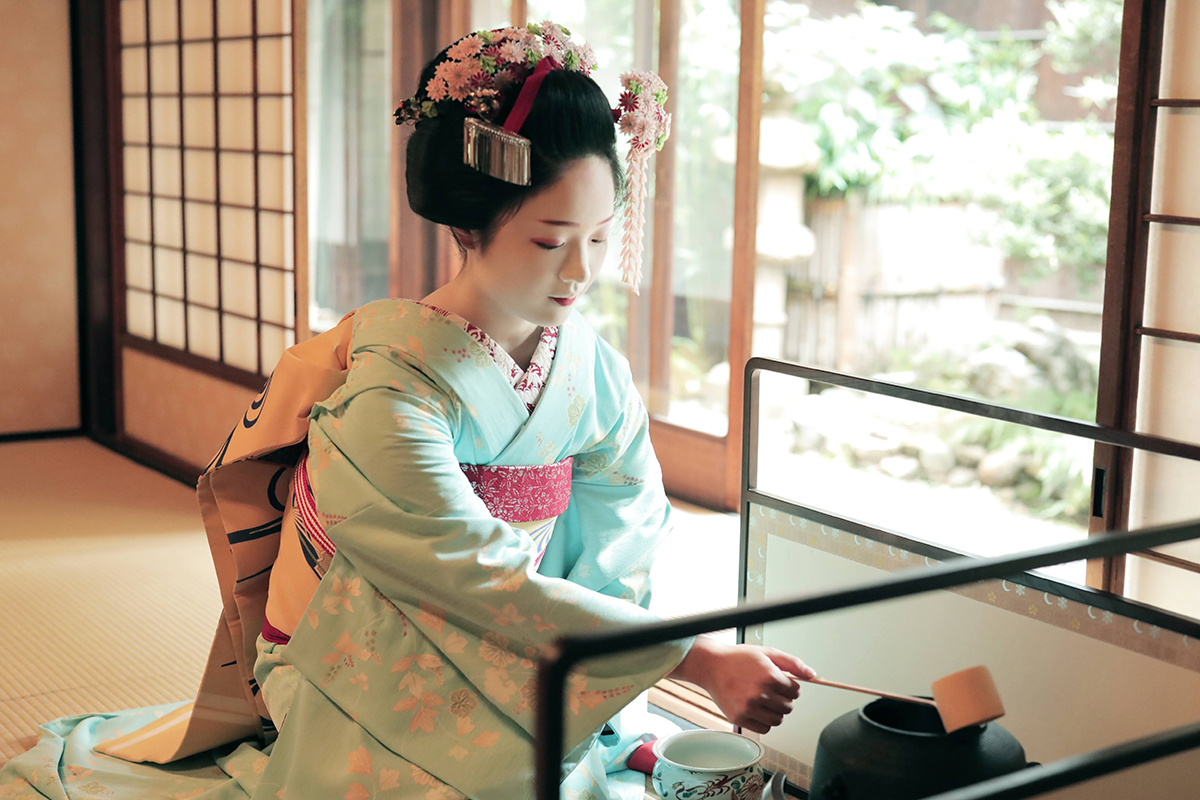 Geisha Tea Ceremony: a geisha is preparing tea