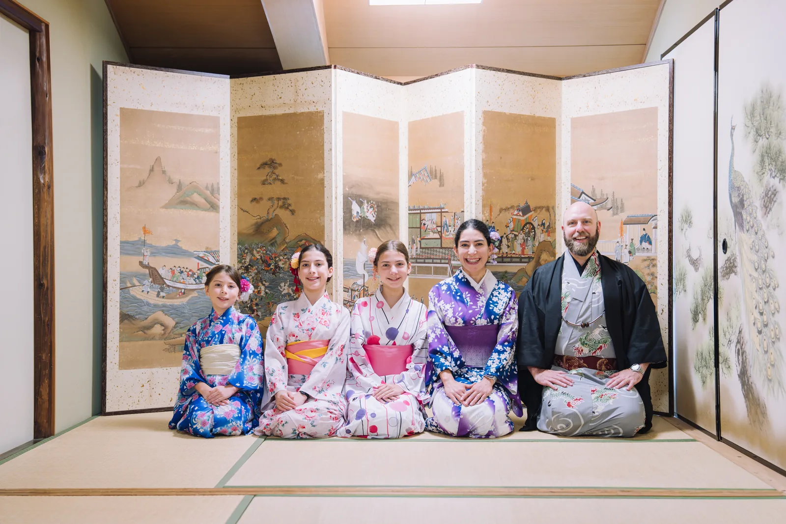 A family seated together in a tea room
