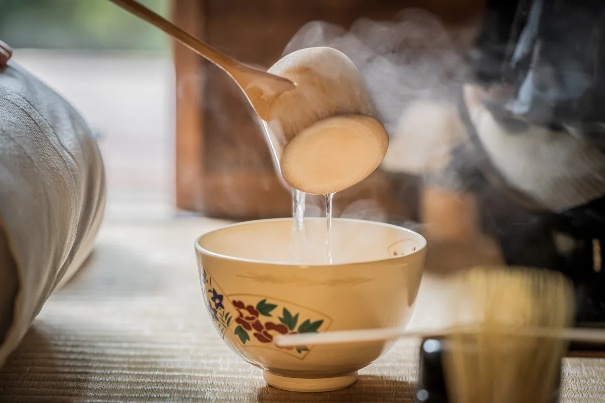 Hot water being poured during tea preparation