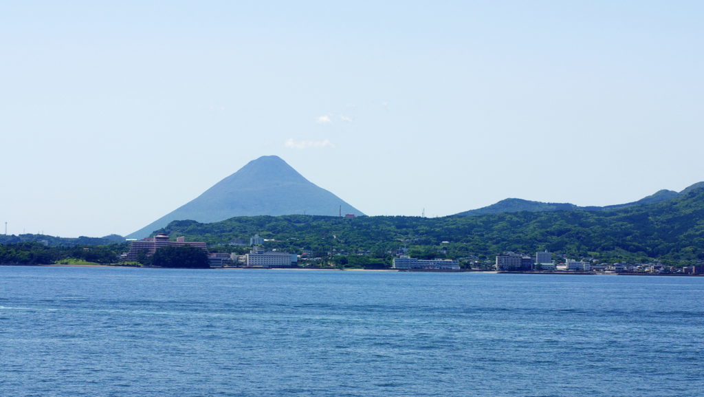 Ibusuki hot spring town and Kaimondake volcano. Taken from the ferry Mishima ship.