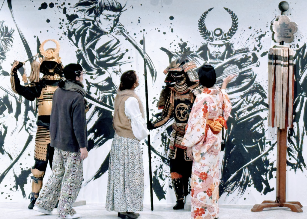 Guests are taking a closer look at the exhibits of Samurai Museum Tokyo